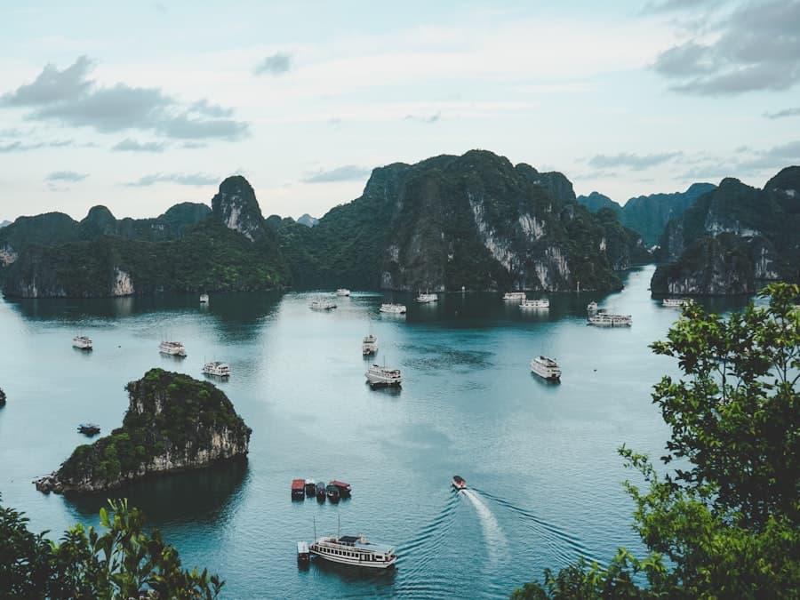 Limestone karst towers rising out of the green water of Ha Long Bay
